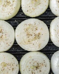raw seasoned onion on a pan.