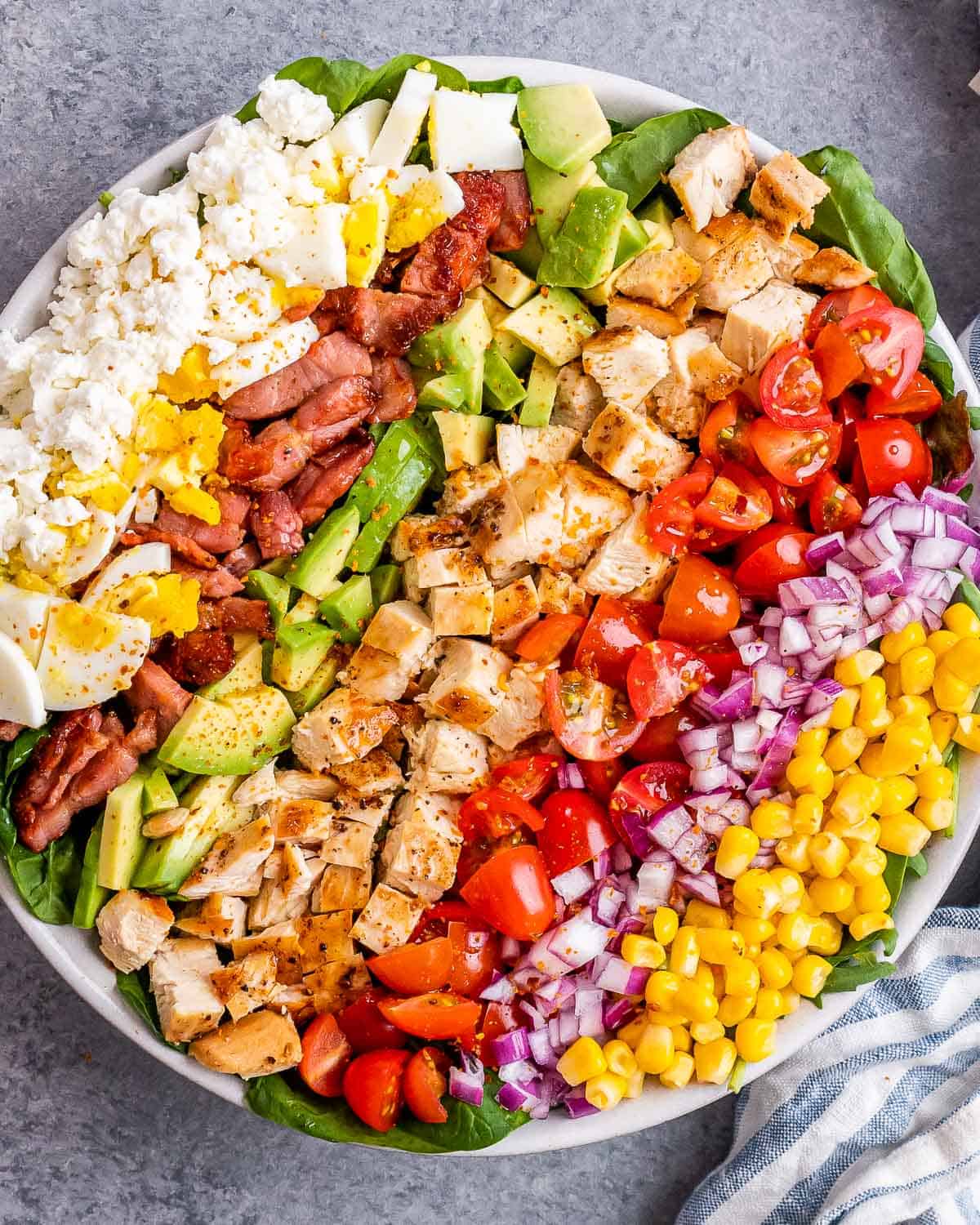 Angled shot of the Chick Fil A Cobb Salad showing the fresh ingredients, including juicy chicken and bright cherry tomatoes.