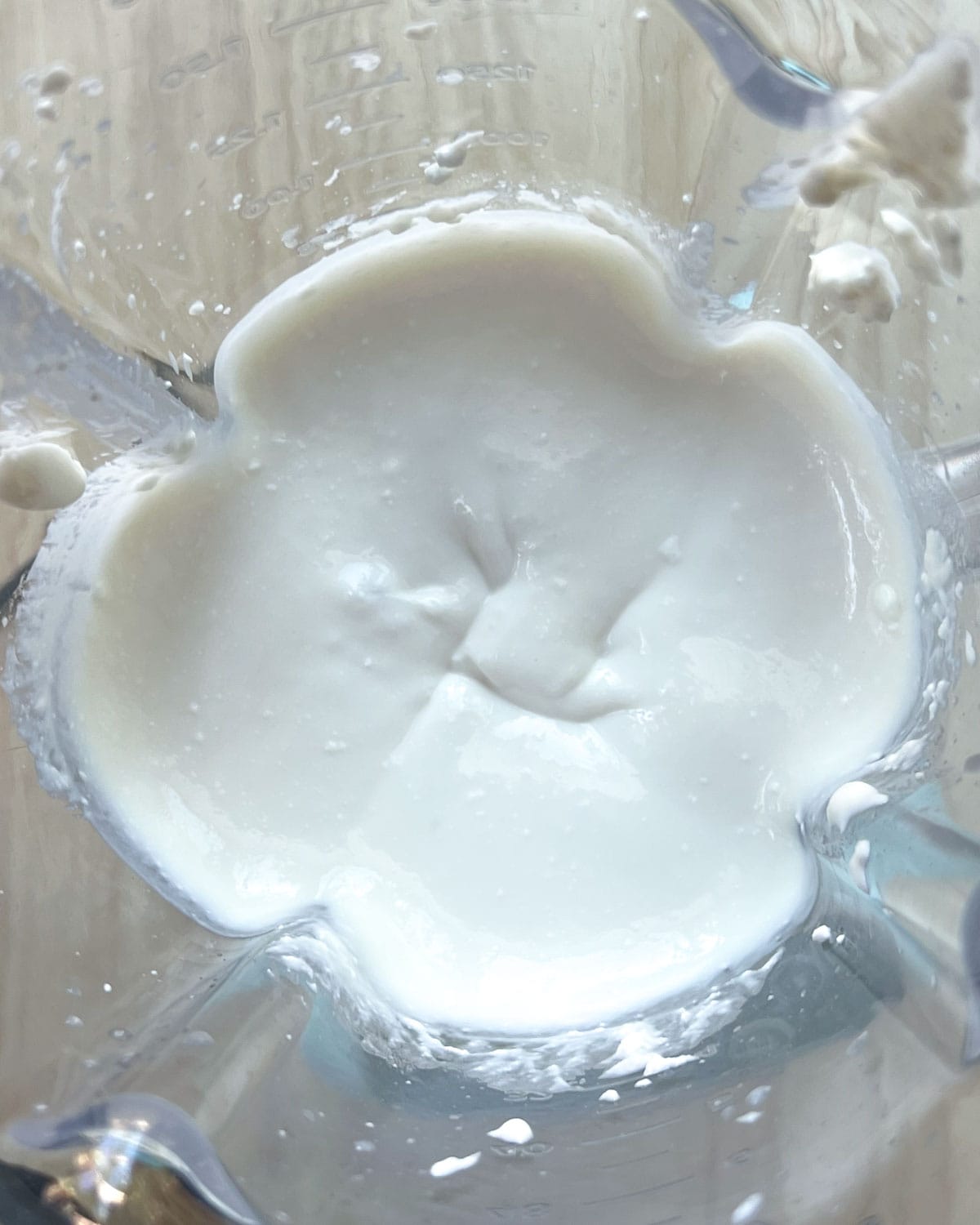 blended cottage cheese with maple syrup in a blender.