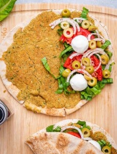 assembling the falafel smash pita.