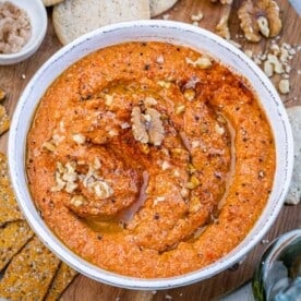 a round bowl of roasted pepper dip called muhammara.