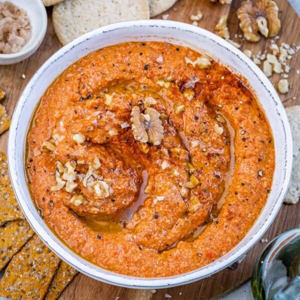 a round bowl of roasted pepper dip called muhammara.