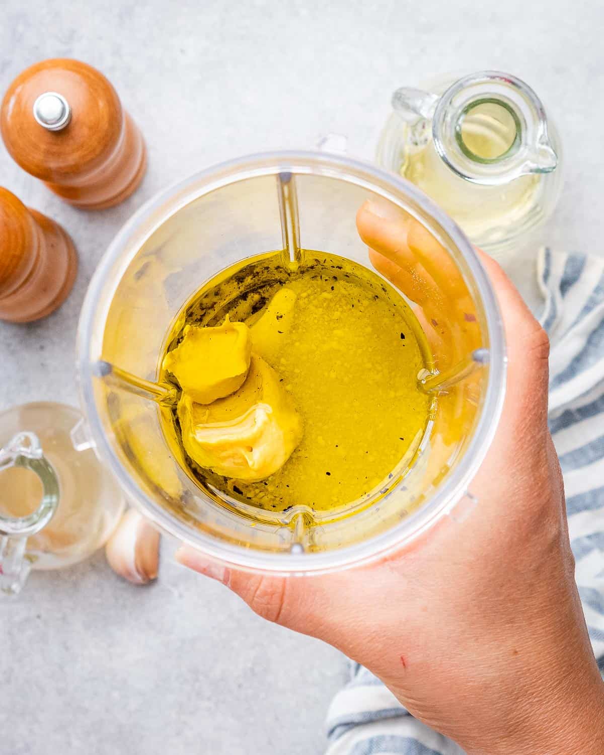 pasta dressing ingredients in a cup before mixing.