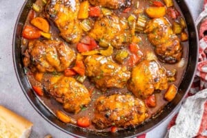 chicken stew with veggies in a skillet.