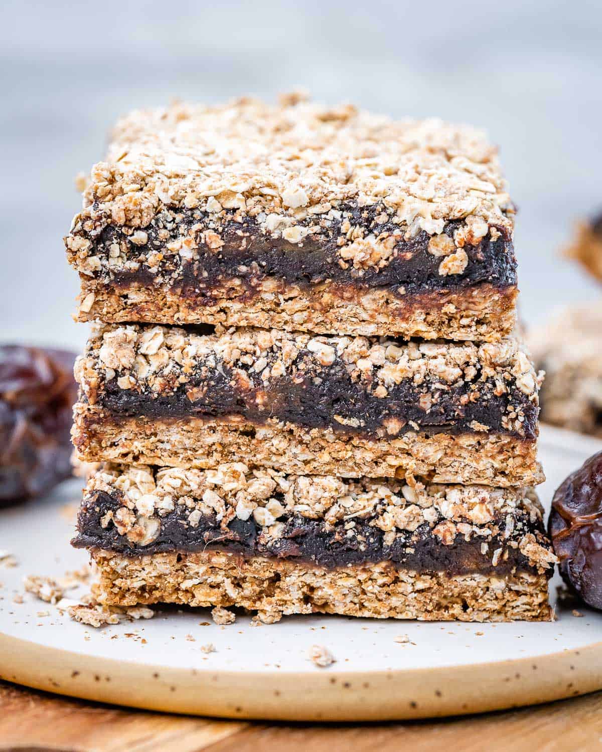 3 date bars stacked over each other on a cutting board.