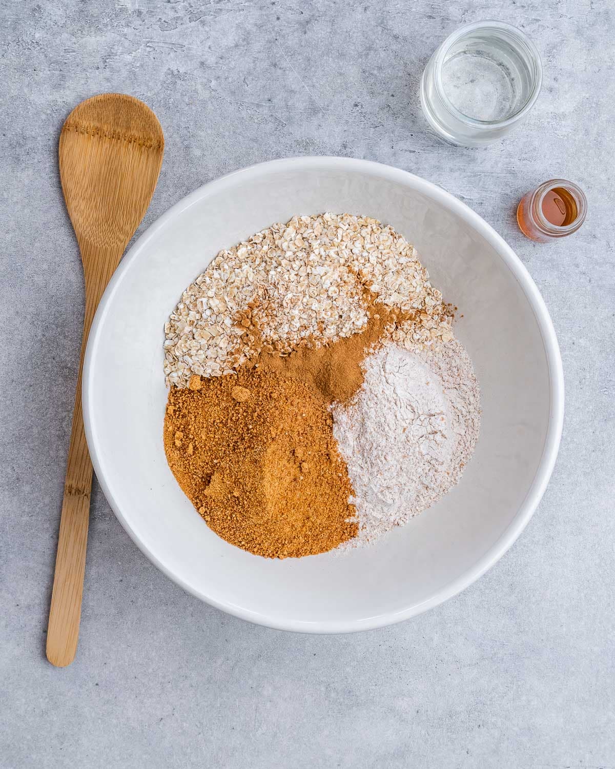 oats, flour, cocoa powder, added to a plate.