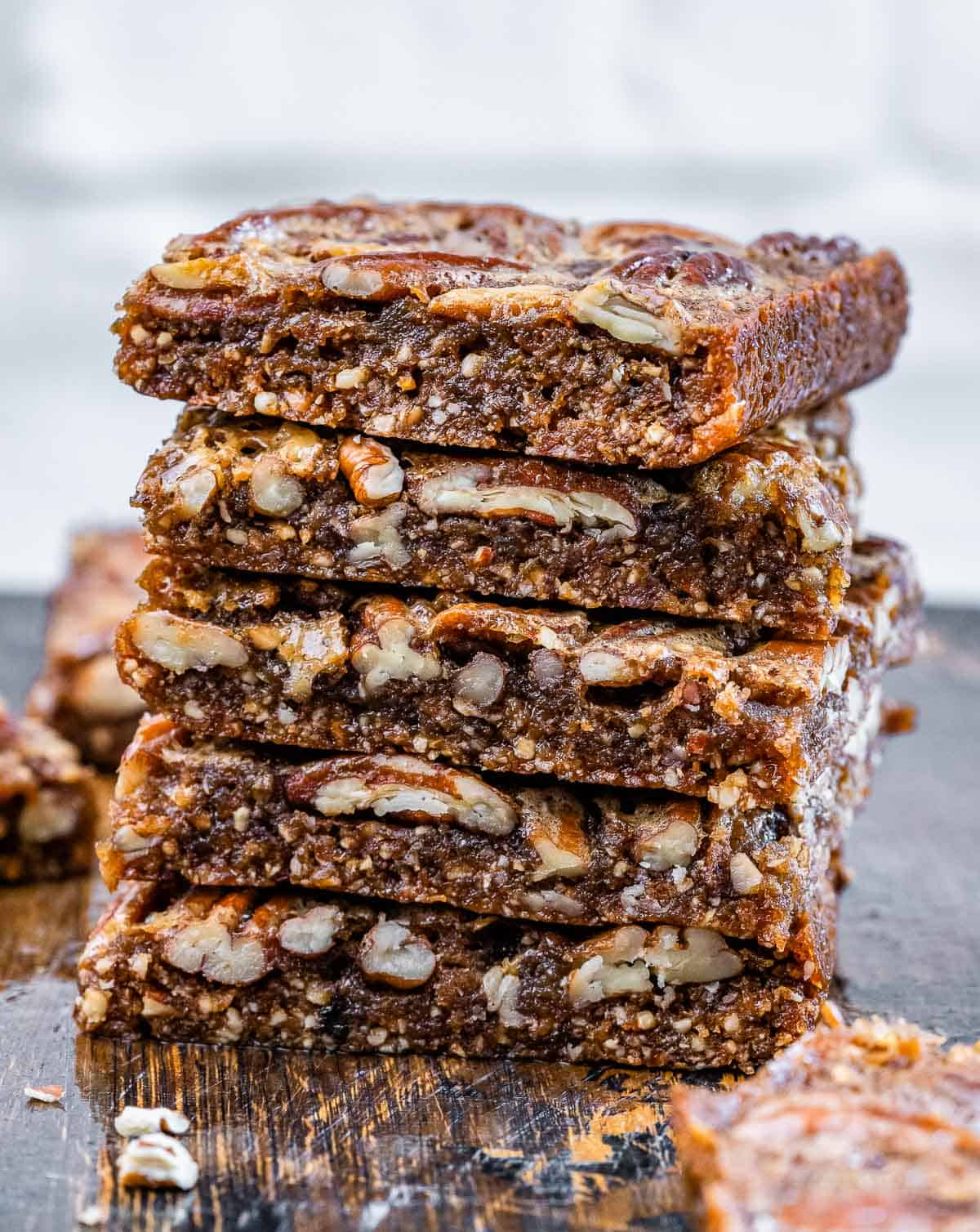 Healthy pecan pie bars stacked.