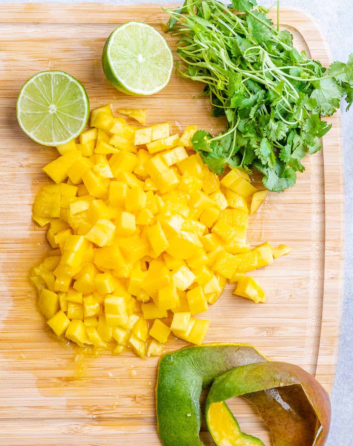 chopped mango on a cutting board.