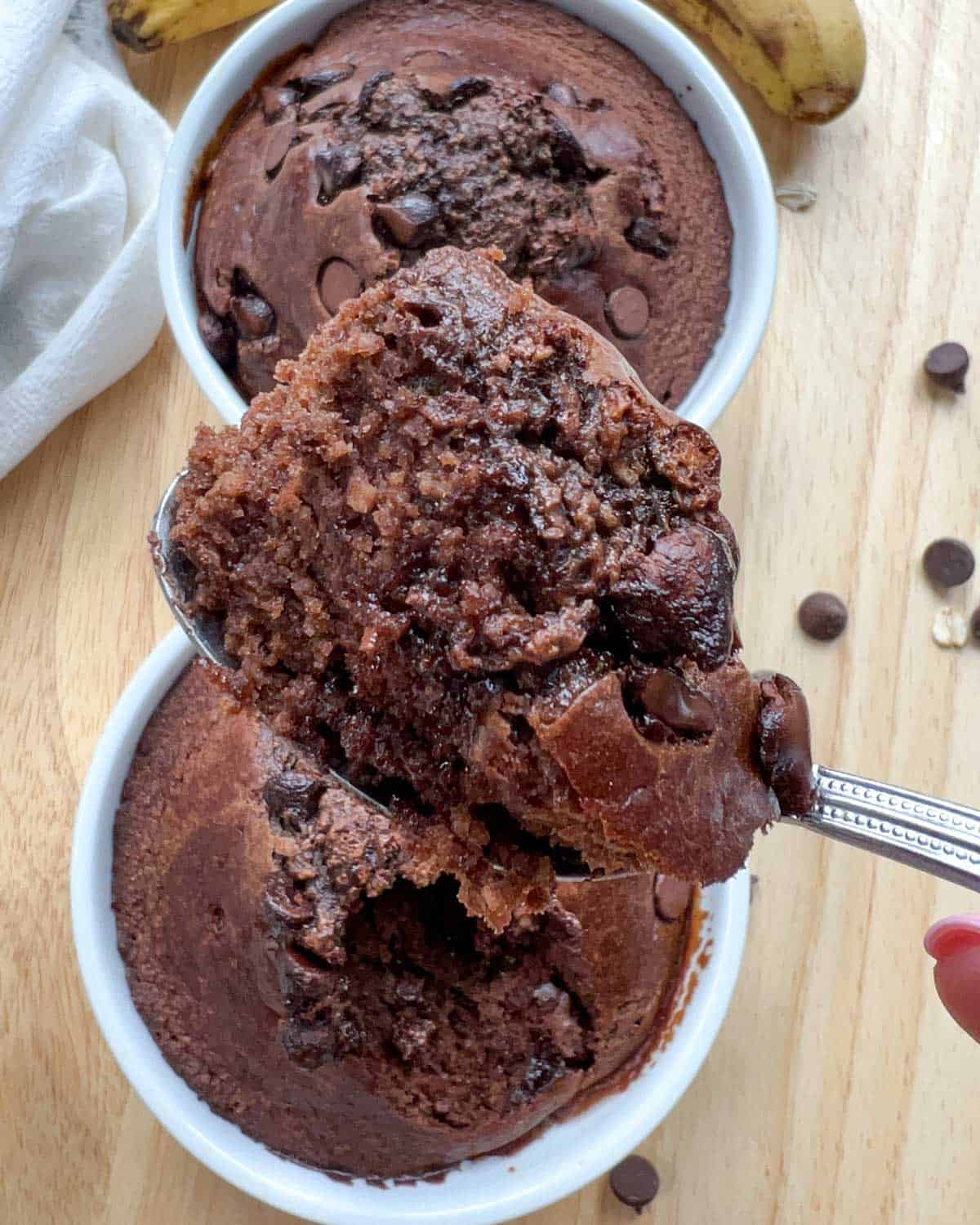 a spoonful of the chocolate baked oats over the ramekin.