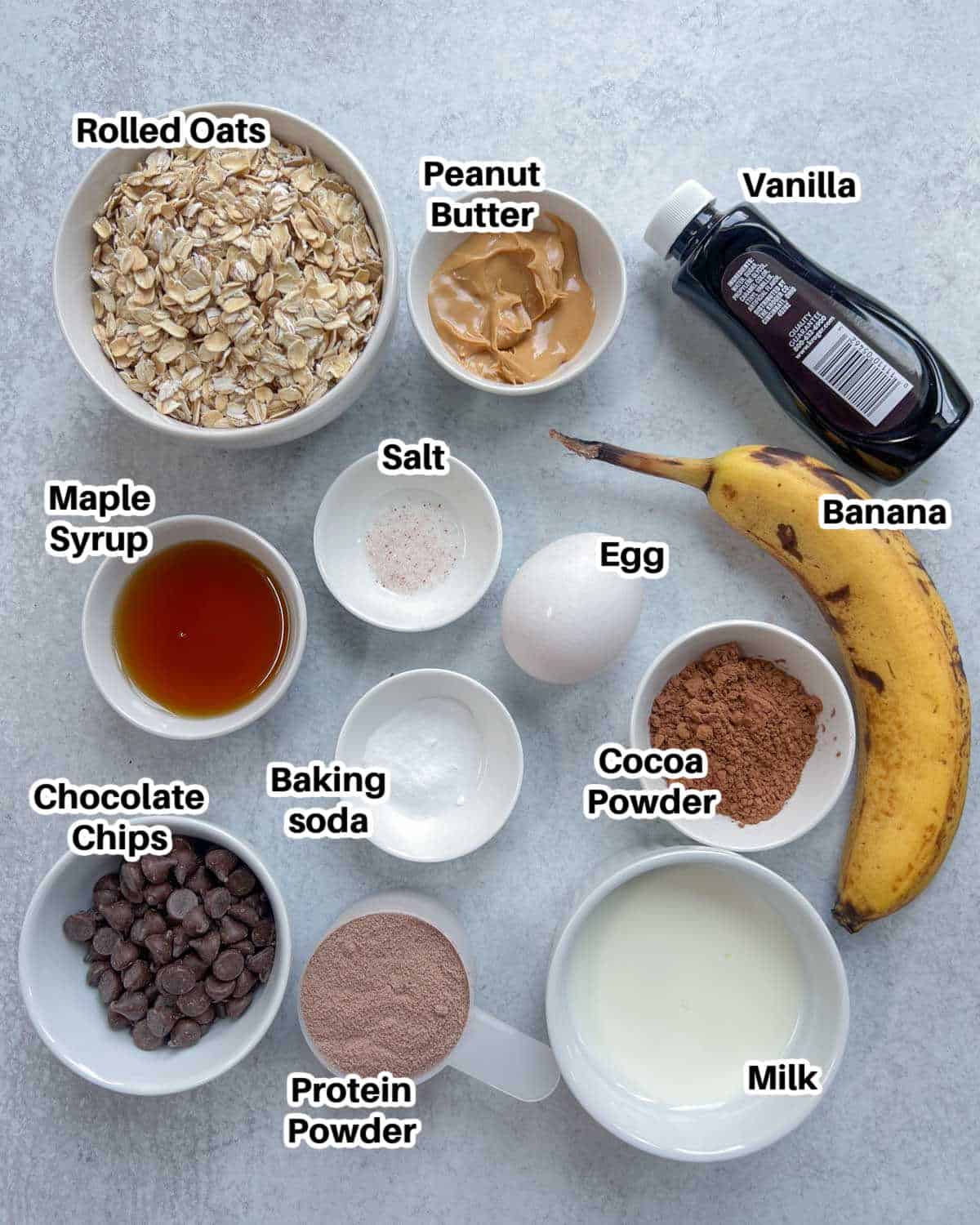 ingredients to make protein baked oats laid out on a flat surface.