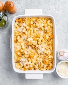 Butternut squash Mac and cheese in a white casserole dish.