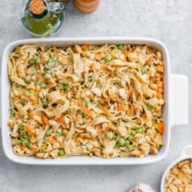 A baking dish with pasta made with chicken pot pie filling.