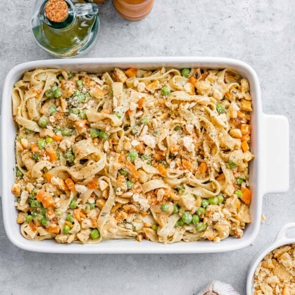 A baking dish with pasta made with chicken pot pie filling.