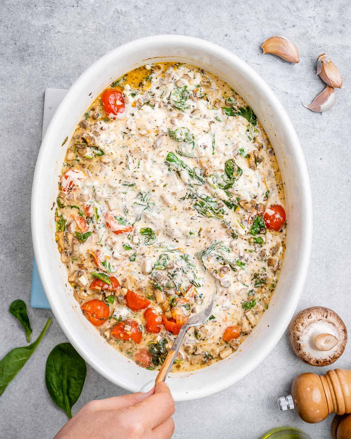 creamy tomato and spinach sauce in a dish.