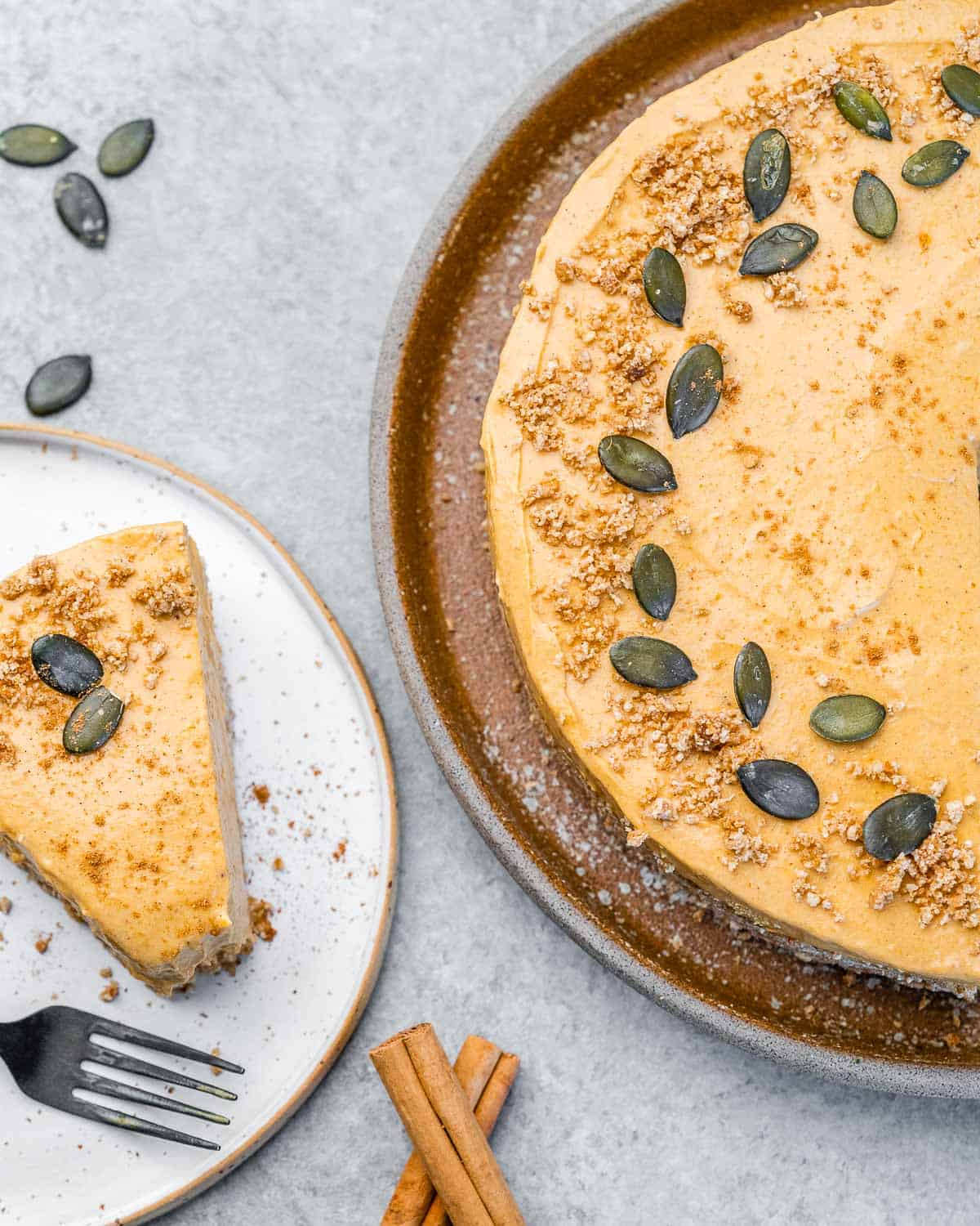 No bake pumpkin cheesecake sliced and served on a white plate.