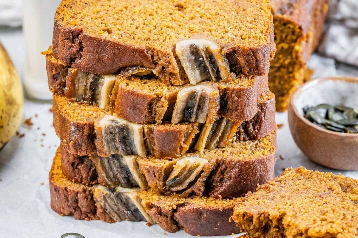 Slices of pumpkin banana bread stacked.