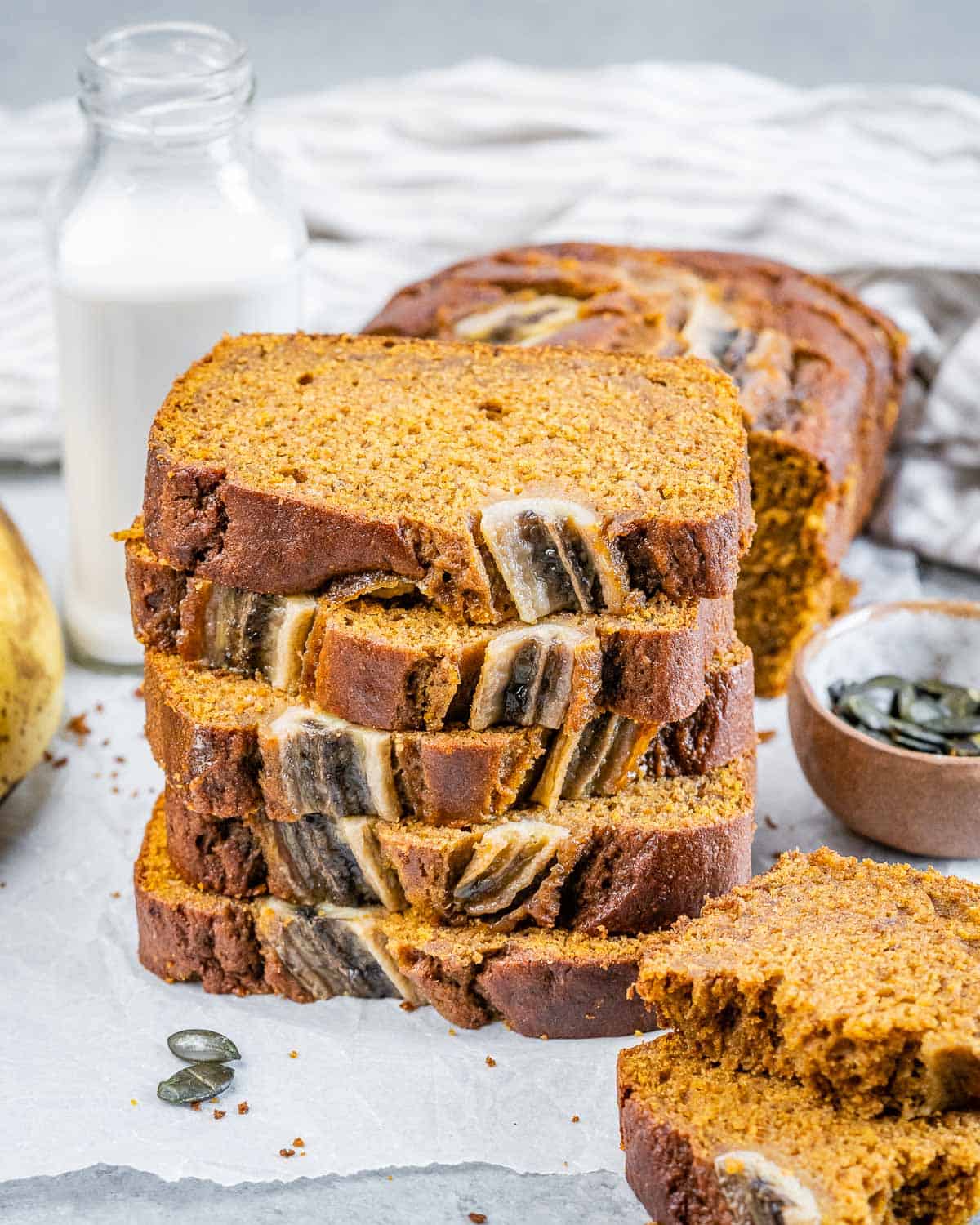 Slices of pumpkin banana bread stacked.