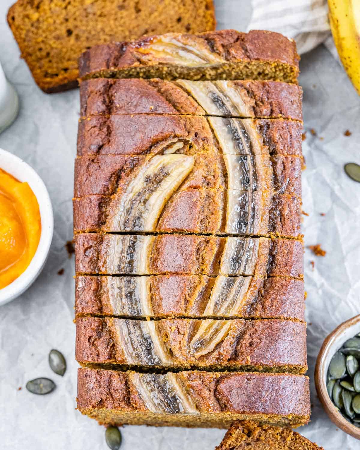 Sliced loaf of pumpkin banana bread.