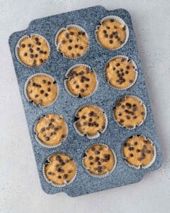 muffin batter in a muffin pan before baking.