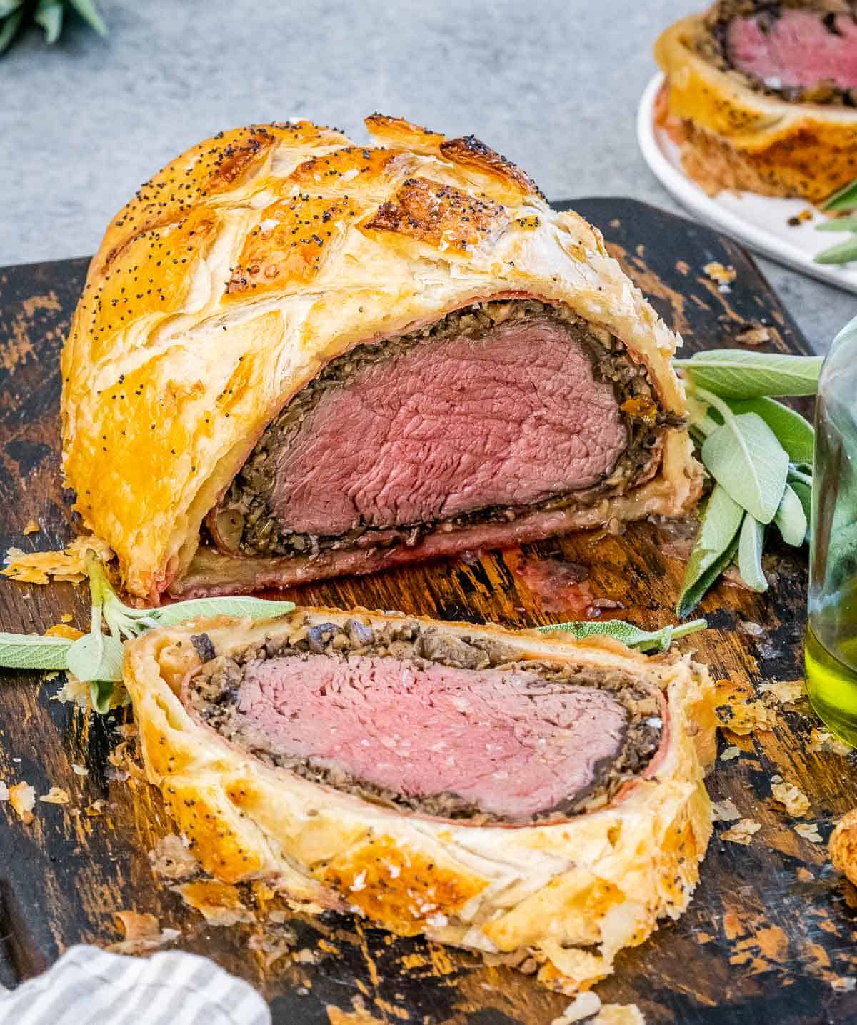 Sliced beef wellington on a cutting board.