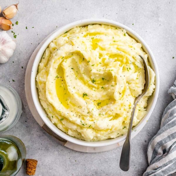 A small round bowl filled with mashed potatoes.