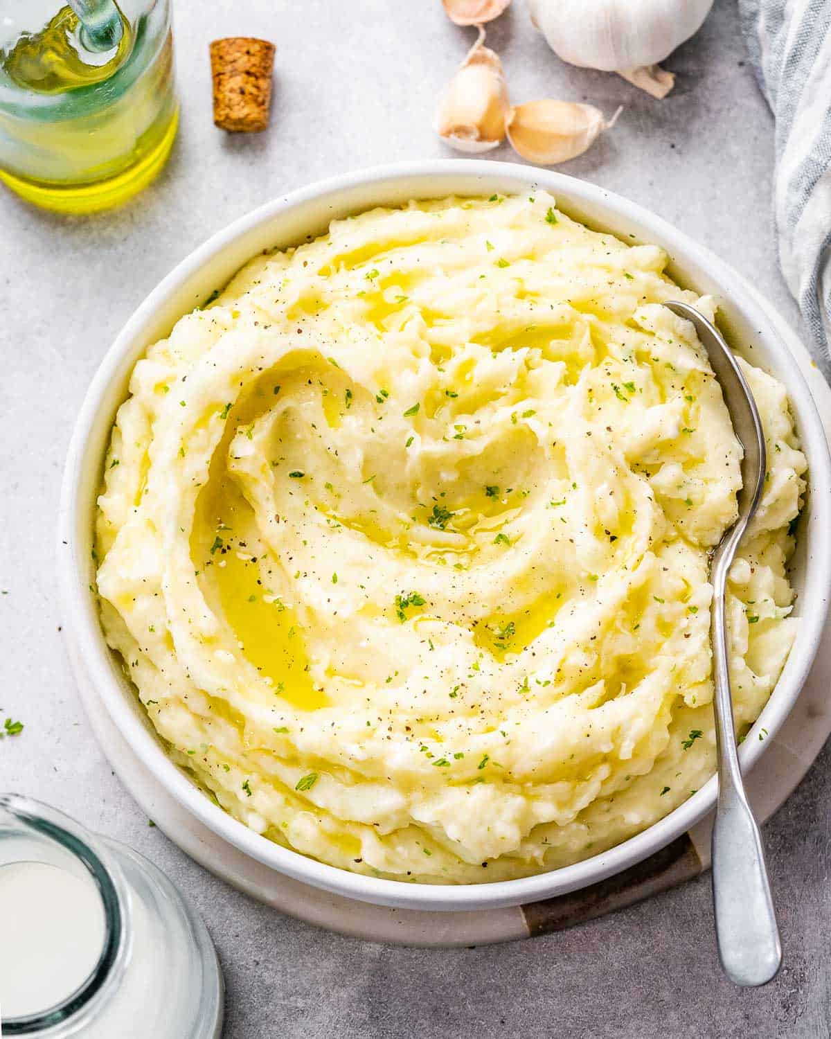 A small round bowl filled with mashed potatoes.