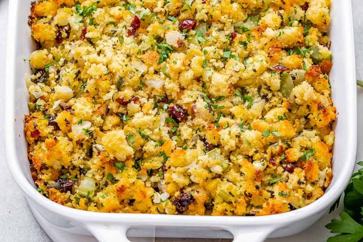 Cornbread is served in a white dish.