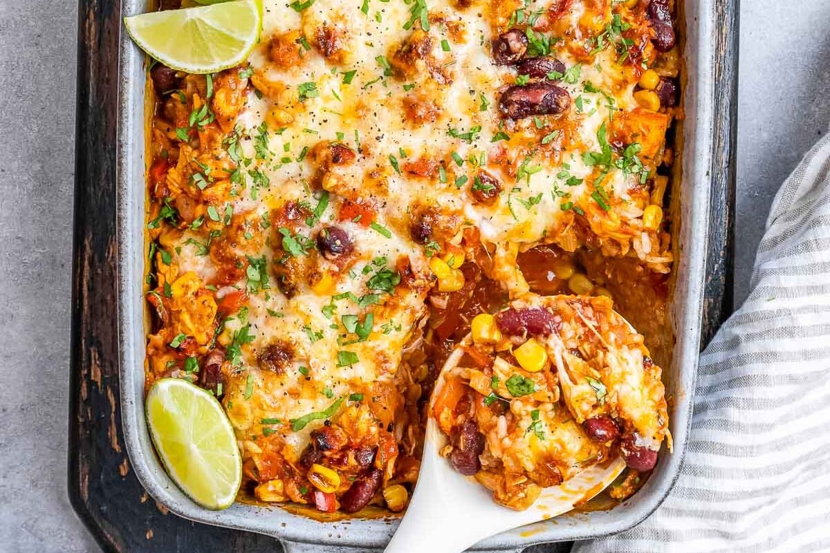 cooked Mexican chicken casserole in white baking dish