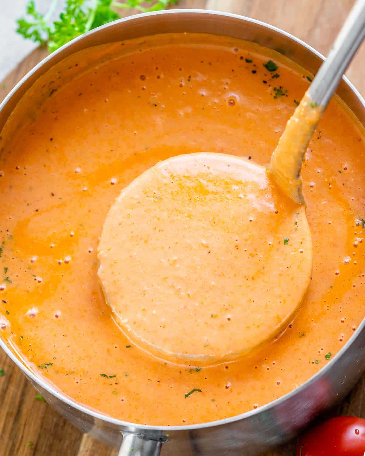 soup in a pot with a spoonful of soup being removed from the pot.