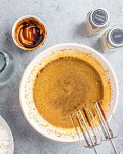 eggs molasses, and oil, mixed in a bowl.