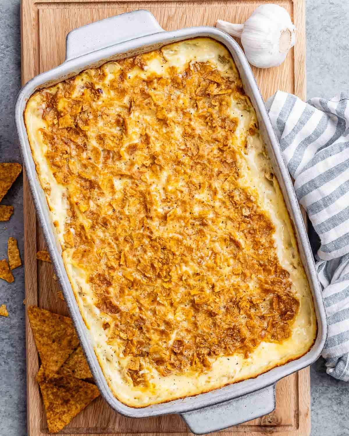 Baked hash brown casserole on a wooden board.