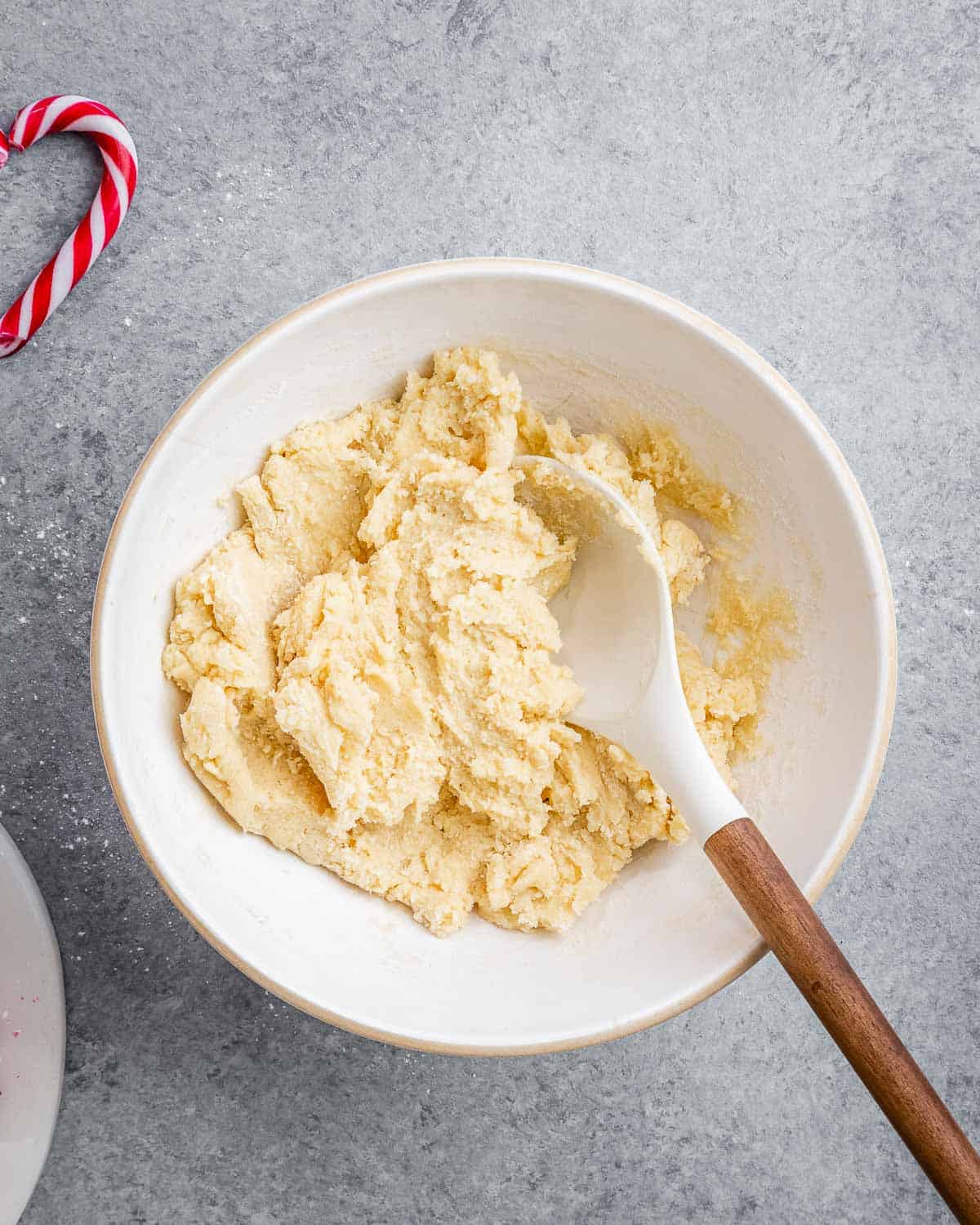 flour and egg mixture mixed together in a bowl to form a cookie dough.