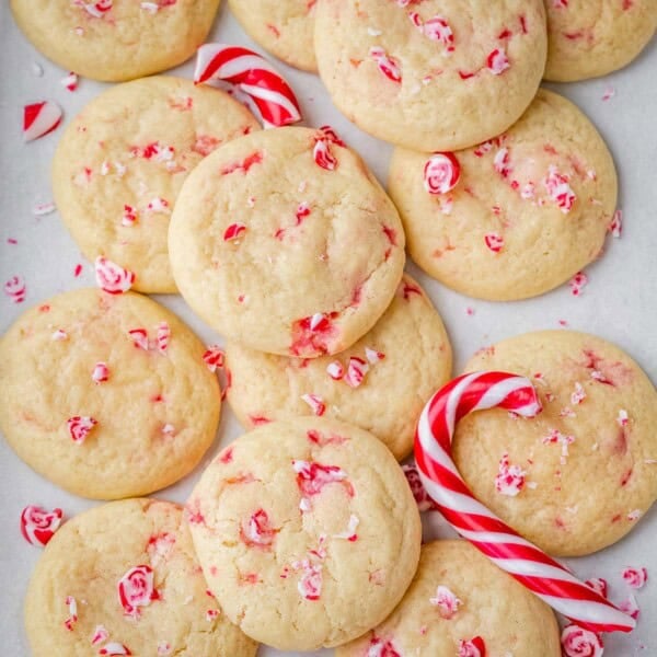 Sugar cookies with peppermint on a flat surface.