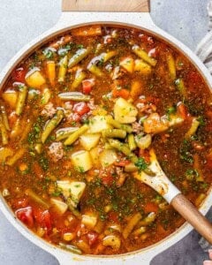 one round pot of cowboy soup with vegetables and ground beef