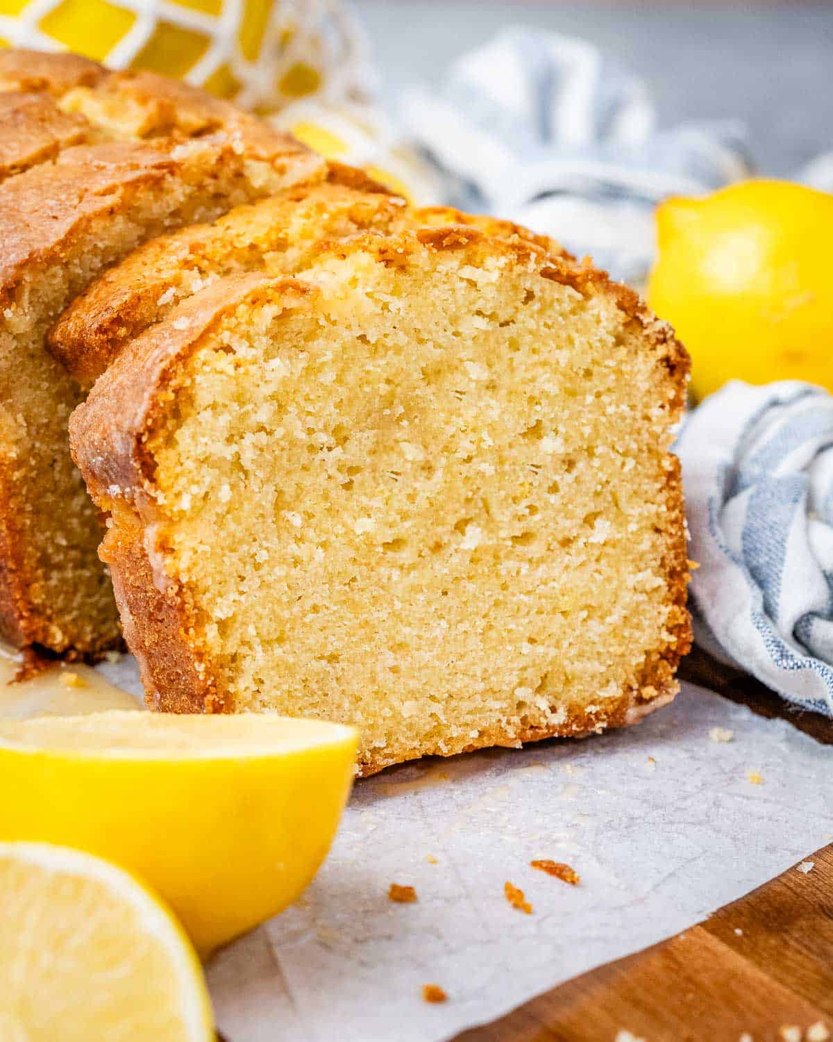 sliced lemon cake on a cutting board.