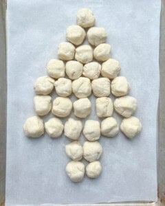 dough before baking placed on a sheet pan in a tree-like manner.