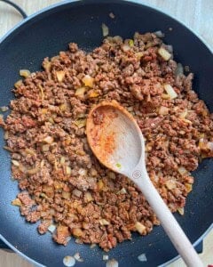 seared beef with seasonings and onions.