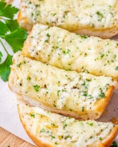 sliced garlic bread on a cutting board.