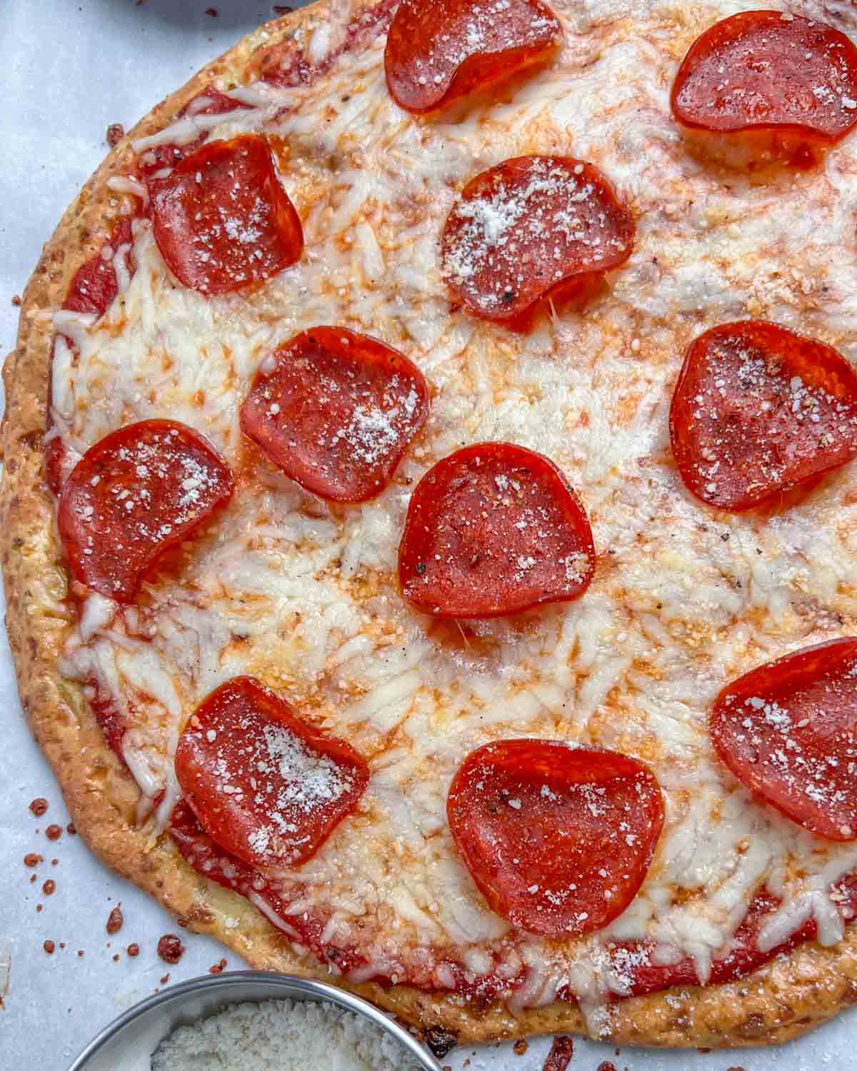 baked pizza topped with pepperoni.