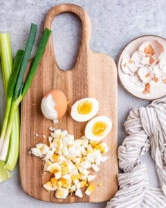 Chopped egg on a cutting board.