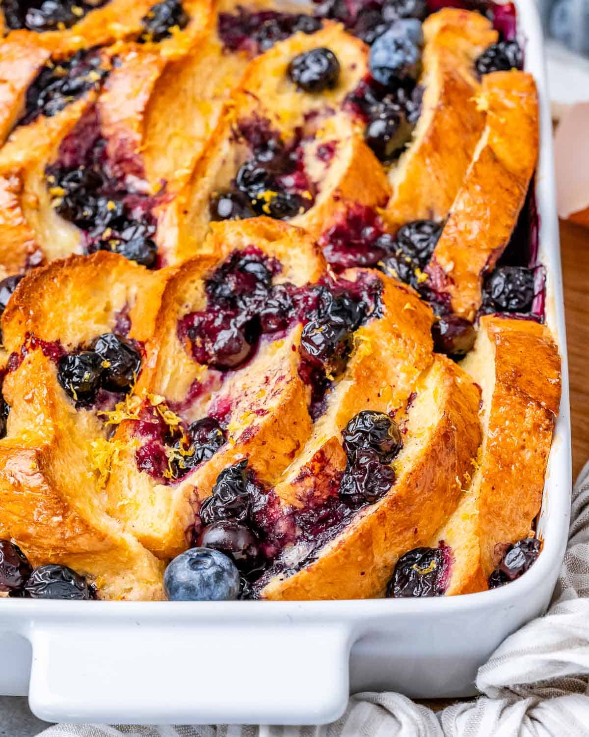 french toast baked in a casserole with blueberries.