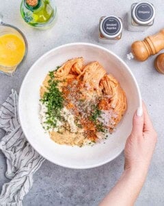 A white bowl with meatball ingredients.