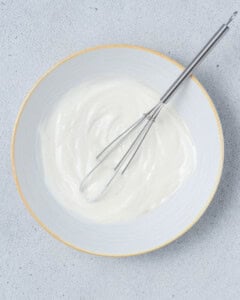 whisk in a bowl with yogurt.