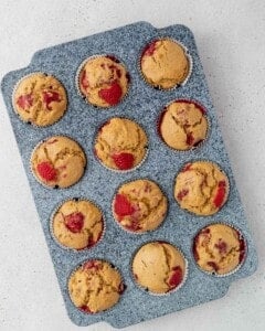 raspberry muffins in a pan.