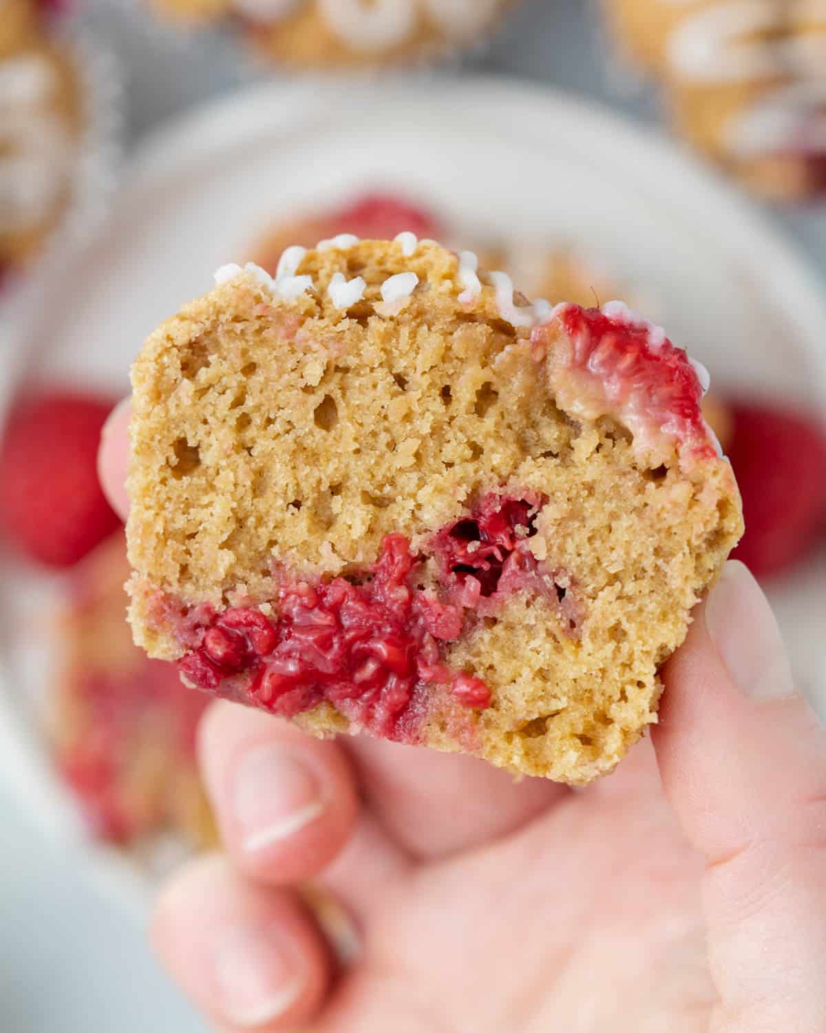 hand holding half a muffin.
