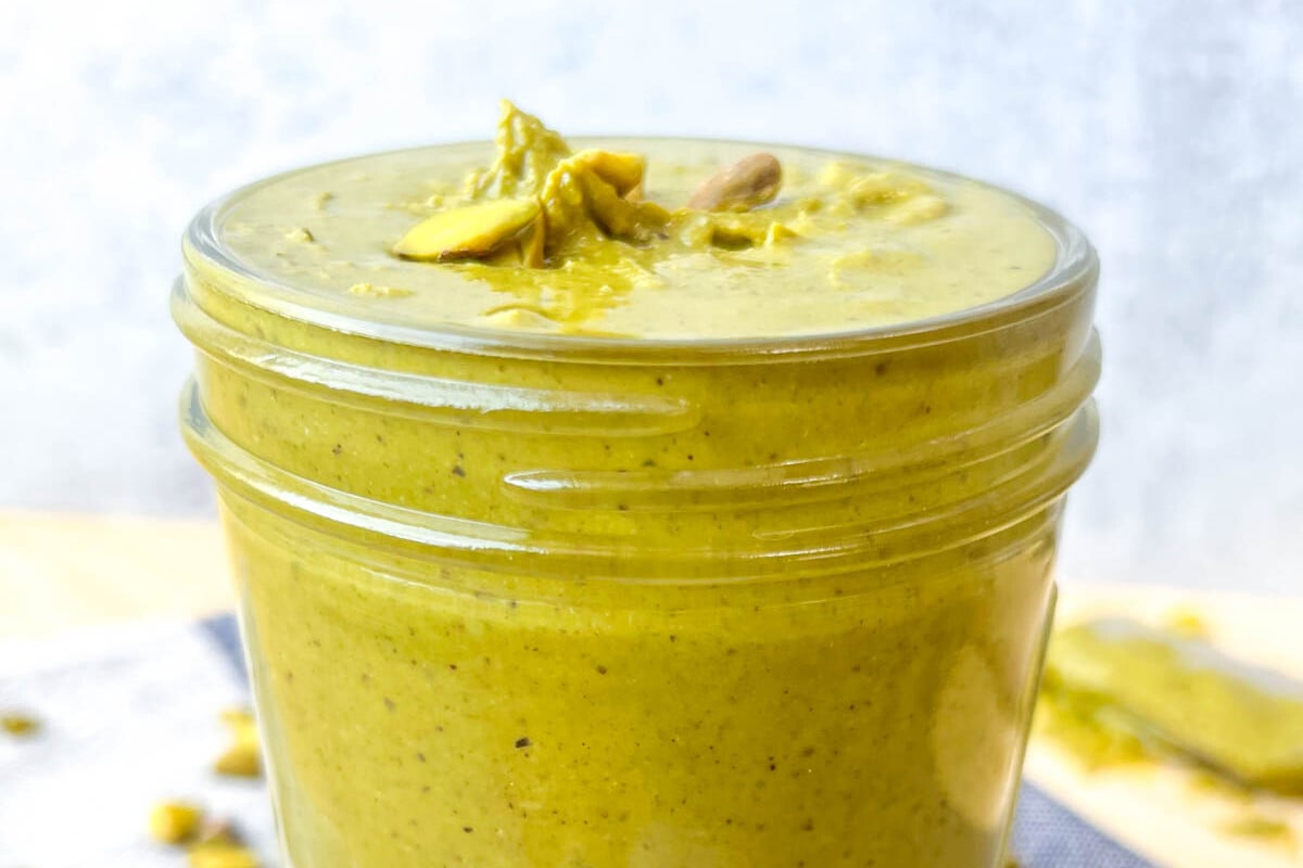 a jar filled with pistachio cream.