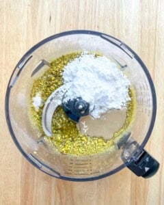 powdered sugar, tahini, salt, and oil added into the blender with the blended pistcahio.