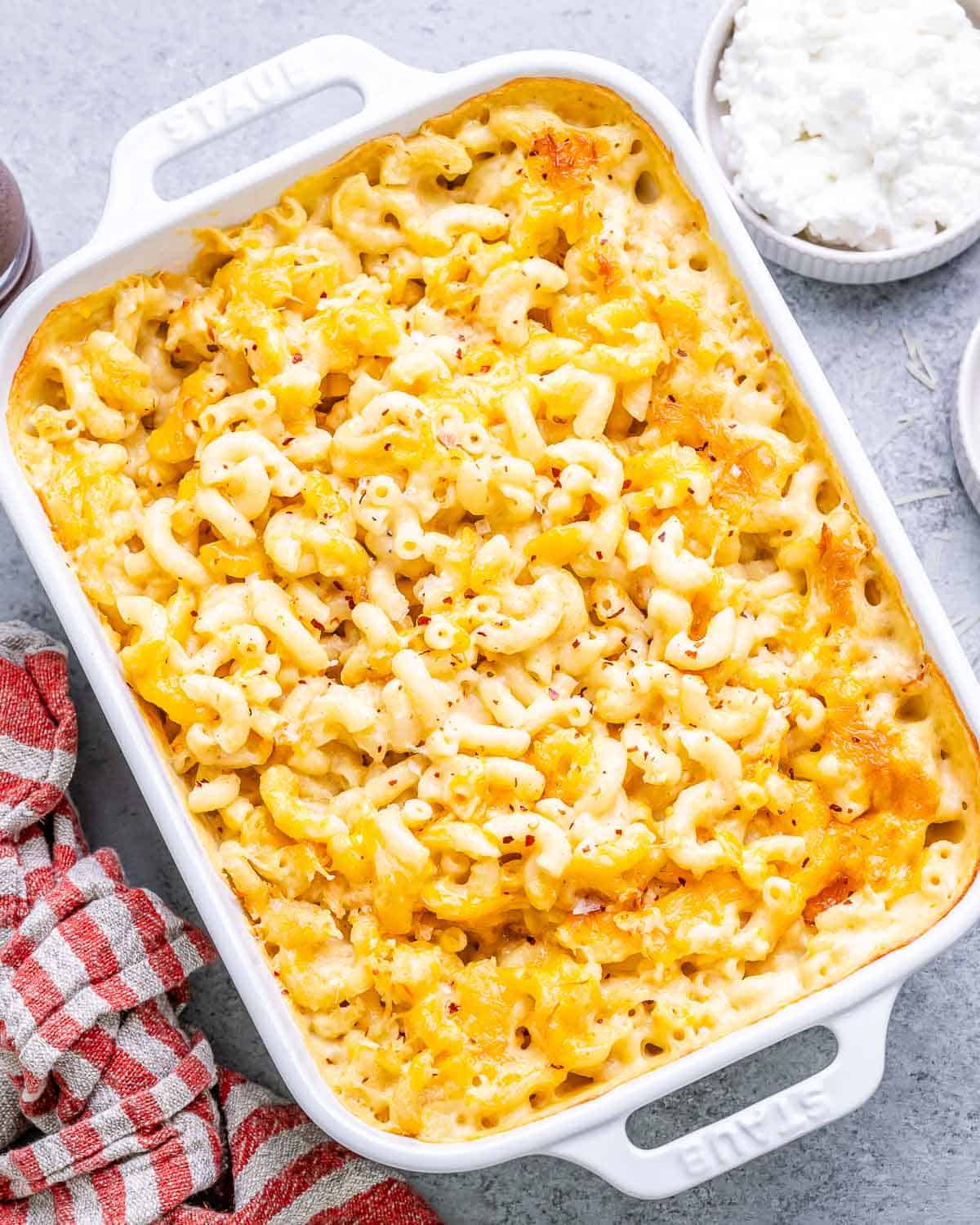 Fully baked mac and cheese in a casserole dish with a golden, melted cheese top.