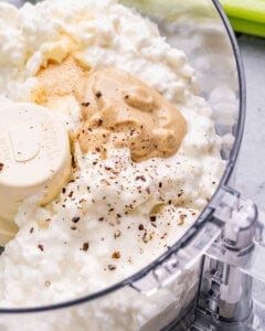 Ingredients in a food processor ready to be blended.