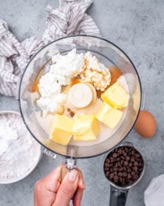 Butter, cottage cheese, vanilla, and sugar in a food processor before blending.